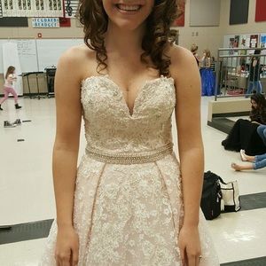 I’m selling this prom/pageant dress. Only wore twice. No damage or seams pulled.